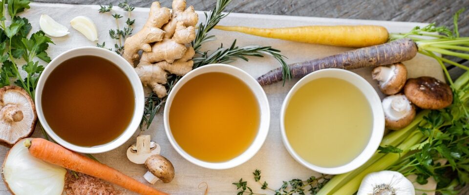 ingedients for bone broth laid out on a kitchen bench
